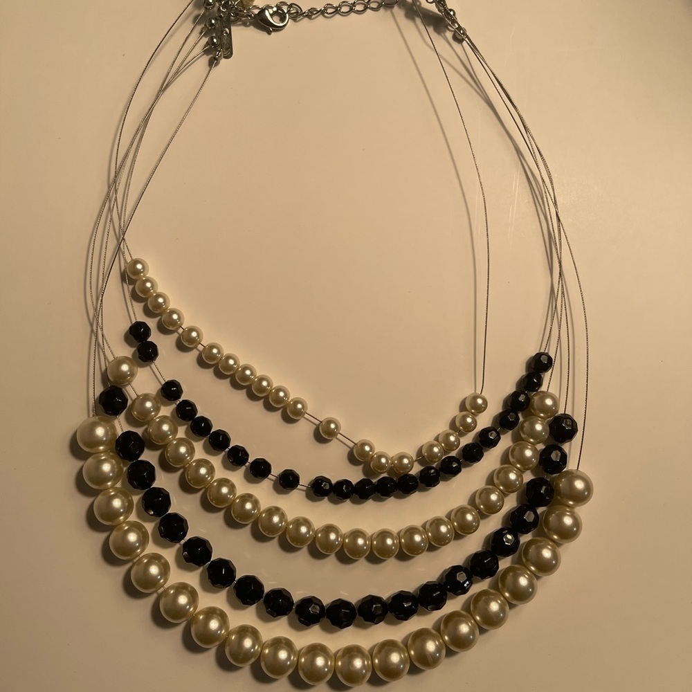 Multi stand necklace. Black beads and pearl beads.  Good condition.